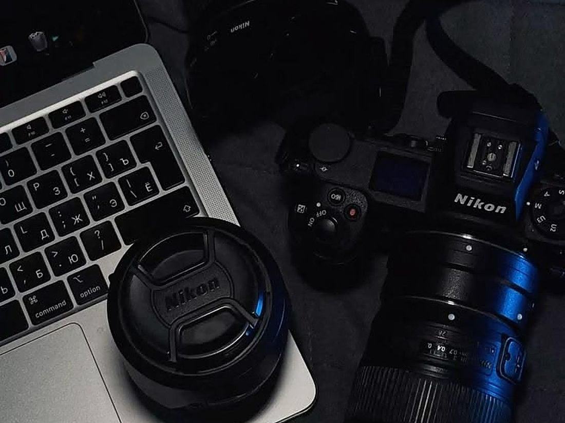 Camera gear and laptop for photo and video editing